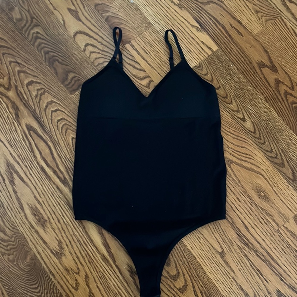 Black ripped body suit